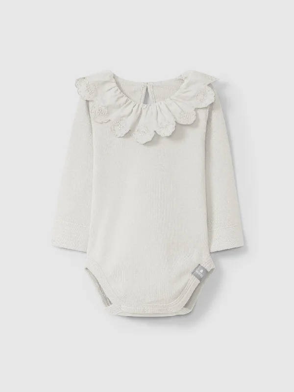 Bodysuit with ruffled collar and embroidery